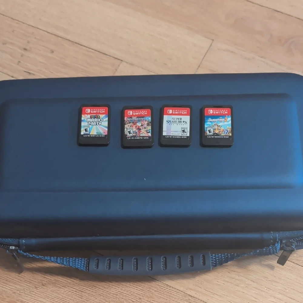 Nintendo Switch with Added Joy cons, Games, Case And Accessories